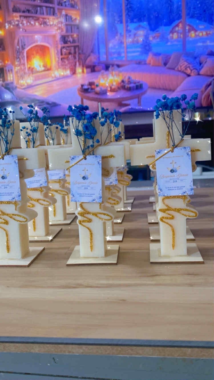 Faith Candle keepsakes in cream wax with blue dried flowers, gold script detail and personalized baptism tags