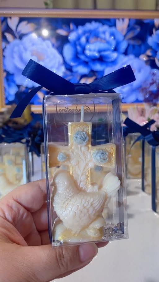 Cross candle with a dove of peace in clear box with navy ribbon