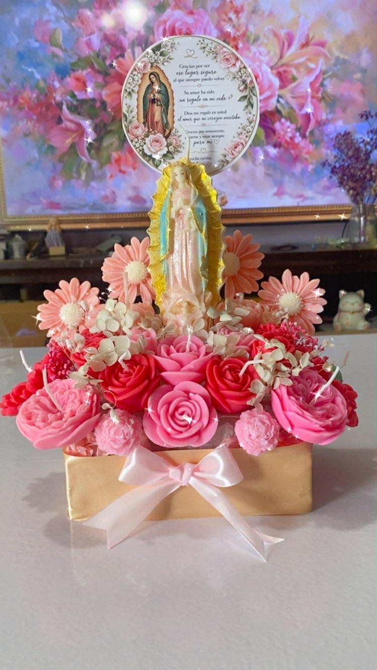 Alternate view of the Virgen de Guadalupe rose centerpiece with pink floral candles and a personalized round topper