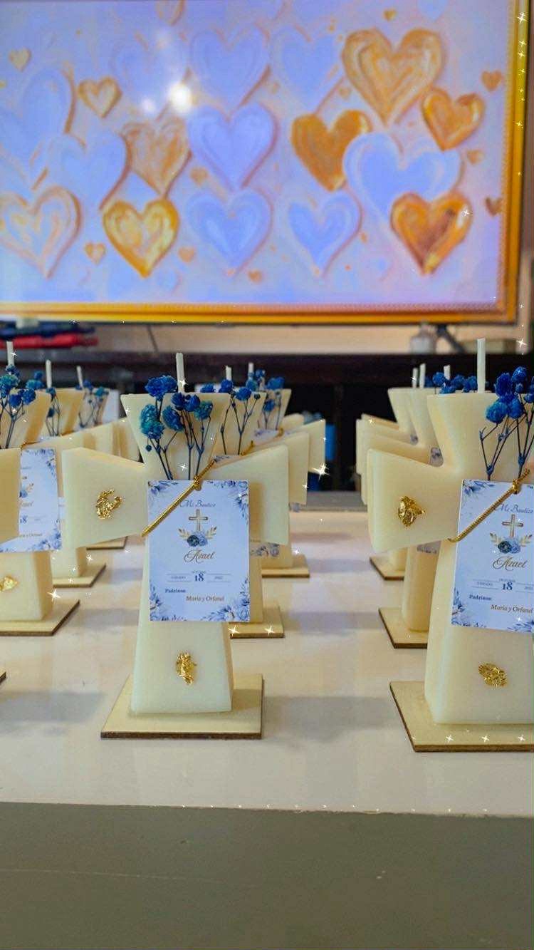 Classic Cross Candle keepsakes with blue dried flowers and personalized baptism labels