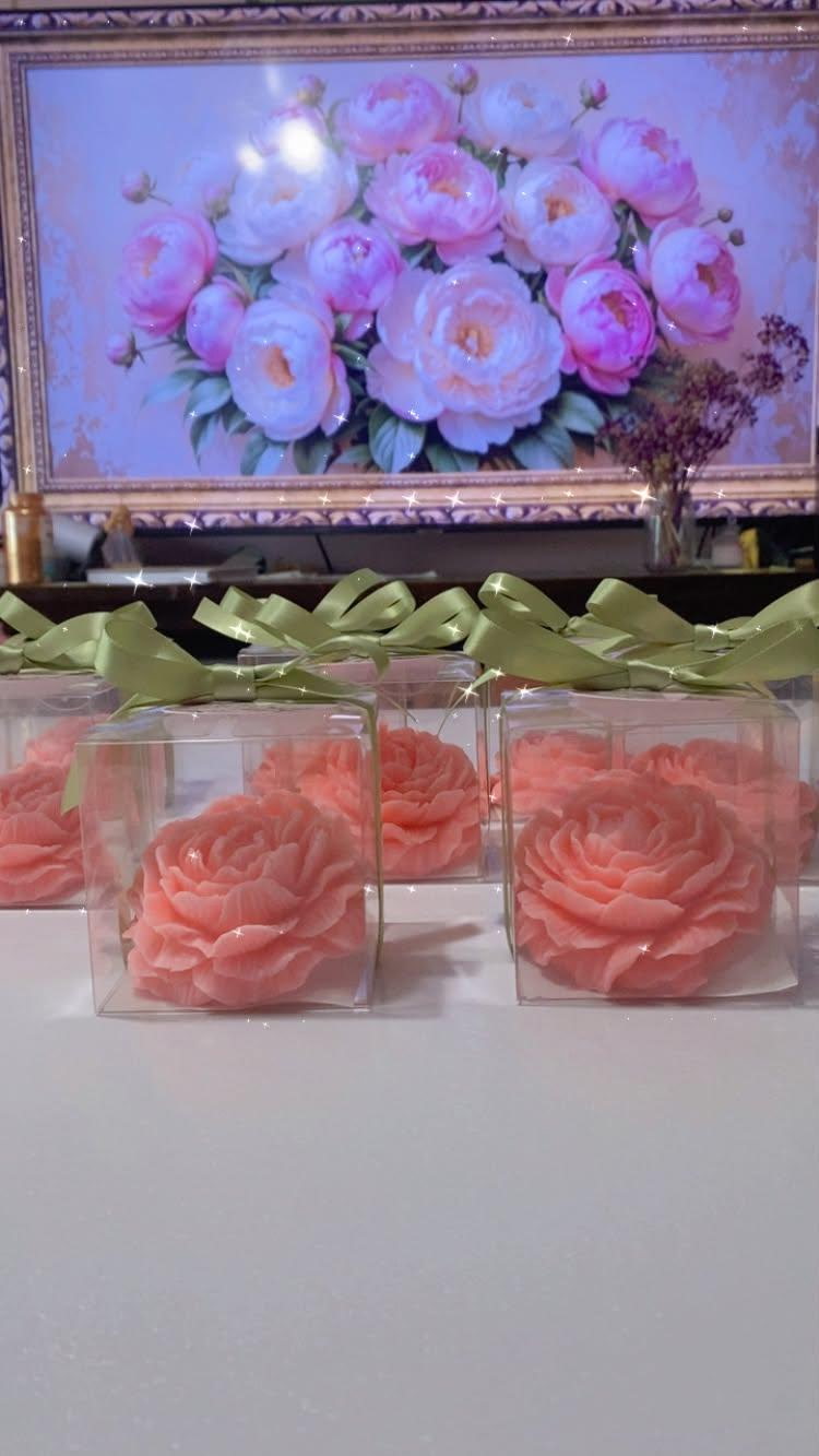 Handcrafted rose-shaped peony soaps, personalized and packaged for gifting.