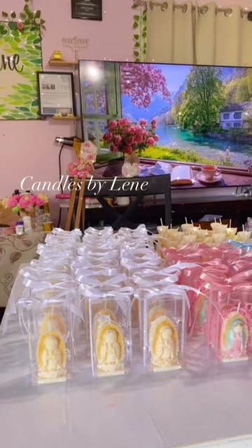Hand-painted Virgin of Guadalupe candle favors in clear boxes with ribbons
