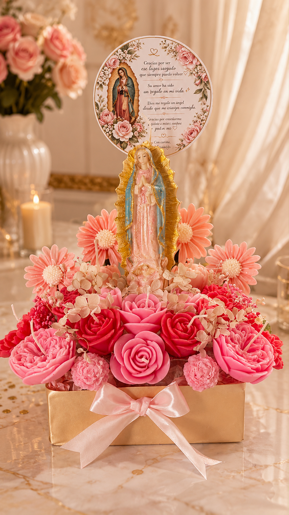 Virgen de Guadalupe centerpiece with pink rose-shaped candles, dahlias and a floral topper in a gold box with a satin bow