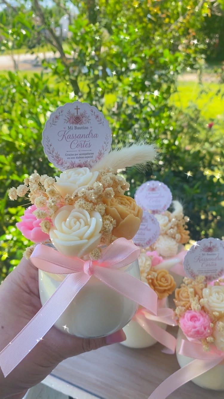 8 oz bouquet candle with wax flowers and a personalized baptism tag